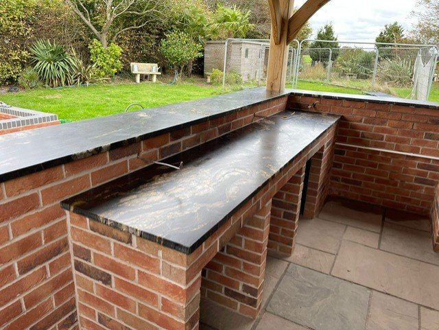 Matrix Gold granite top with oak beam detail