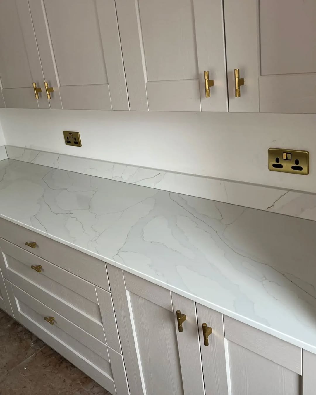 Grey mirror splashback installed in a modern kitchen